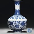 A blue and white ming-style bottle vase. Qianlong underglaze-blue six-character sealmark and of the period (1736-95) 