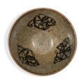 A 'Jizhou' 'papercut' bowl & A painted 'Jizhou' black-glazed 'prunus' bowl, Southern Song dynasty