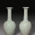 A rare pair of carved Qingbai 'Day Lily' vases, Song Dynasty (AD 960-1279)