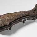 A large and rare gold, turquoise and agate-inlaid iron fish-form fitting, Warring States