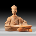 A pottery figure of a seated Qin player, China, Sichuan province, Han dynasty (206 BC-220 AD)