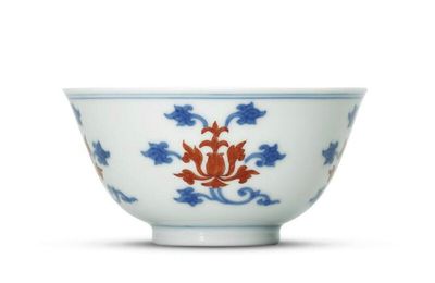 A fine iron-red decorated blue and white 'Lotus' tea bowl, Yongzheng six-character mark and of the period