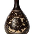 A Chinese Cizhou 'sgraffiato' black-glazed bottle vase, yuhuchun ping, Jin dynasty (1115-1234)