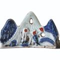 A blue and white and copper-red 'mountain' brush-rest, Ming dynasty, 17th century