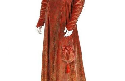 A Maria Gallenga stencilled persimmon velvet medieval inspired gown, 1920s
