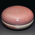 A peachbloom-glazed seal paste box and a cover, Kangxi six-character marks in underglaze blue and of the period (1662-1722)