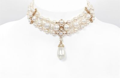 An Attractive Three Strand Natural Pearl and Diamond Necklace