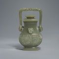 A celadon jade archaistic square-section hanging vase and cover, fangyou, Qianlong seal mark and of the period (1736-1795)