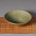 A finely carved Yaozhou celadon ''floral' bowl, Song Dynasty (960-1279)