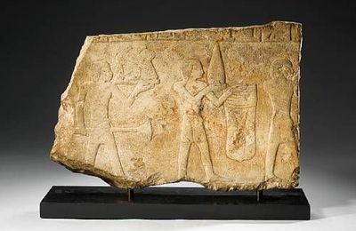 An Egyptian limestone relief fragment. Middle Kingdom, circa 2133-1797 B.C.