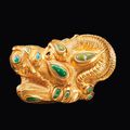 A Sarmatian gold and turquoise lion-griffin head appliqué, circa 3rd-1st century B.C.