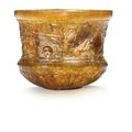 A Roman amber glass cup signed by Ennion, circa first half of the 1st century A.D.