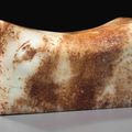 A white and russet-stained white jade pillow, possibly Ming dynasty or later
