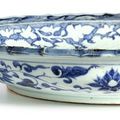 A rare and important blue and white barbed 'banana plant and peony' charger, Yuan dynasty (1271–1368)