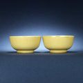 A pair of yellow-glazed bowls. Kangxi six-character marks and of the period