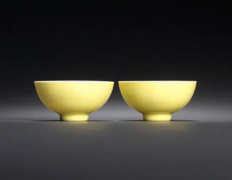 A pair of lemon-yellow-glazed bowls, Yongzheng six-character marks and of the period