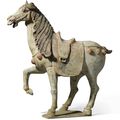 A painted pottery figure of a prancing horse, Tang dynasty, 7th-8th century
