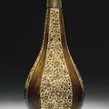 A Safavid lustre painted bottle vase, probably Kirman, Persia, second half 17th century