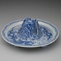 A blue and white 'dragon' jue and stand, Ming dynasty, Yongle reign (1403-1424)