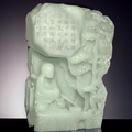 A rare and finely carved pale greenish-white jade carving of Damo in a grotto, Qing dynasty (1644-1911)