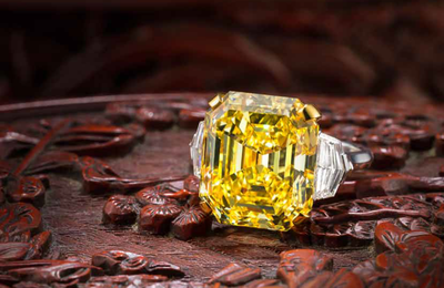 An important fancy coloured diamond and diamond ring