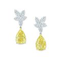 A pair of 15.10 and 14.86 carats pear-shaped fancy yellow diamond and diamond ear pendants