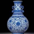 A rare large blue and white moulded vase with ruyi-shaped handles, Qianlong six-character seal mark and of the period (1736-1795