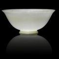 A rare very pale green jade bowl, Qianlong four-character mark and of the period, with additional character jia