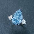 A magnificent 8.26 carat fancy intense blue diamond and diamond ring