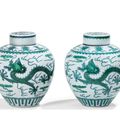 Two green-enamelled 'dragon' jars and covers, Qianlong seal marks and period (1736-1795)