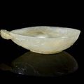 A Chinese Moghul style libation cup in pale celadon jade, 18th centuryA Chinese Moghul style libation cup in pale celadon jade, 