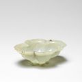 A rare pale green jade quatrelobed 'lotus' shaped brush washer, 17th century