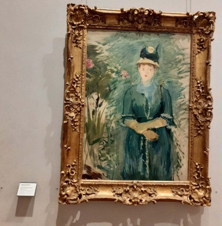 m36Edouart Manet Jeune femme dans les fleurs