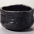 A Teabowl Mino ware, Black Oribe type; glazed stoneware, Momoyama period, early 17th century