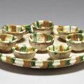 A sancai-glazed buff pottery tray and eight cups, Tang dynasty (618-907)