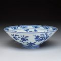 Hibiscus-shaped bowl with flower and fruit decoration in underglaze blue, Ming dynasty, Xuande mark and period (1426-1435)