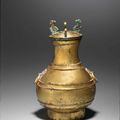 A very rare inscribed gilt-bronze archaic vessel and cover, Hu, Western Han Dynasty (206 BC-9 AD)