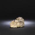 A superb large grey and pale yellow jade carving of a qilin, 17th century