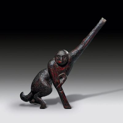 A lacquered wood figure of a monkey on a branch, late Warring States (480-221 BC)