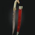 A horse-headed gem set jade-hilted dagger (khanjar) with scabbard, signed Shir Ahmad, hilt: North India, 1675-1725; blade: circa