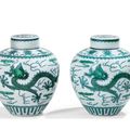 Two green-enamelled 'dragon' jars and covers, Qianlong seal marks and period (1736-1795)