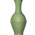 A large carved Longquan celadon ‘phoenix-tail’ vase, Ming dynasty, early 15th century