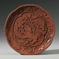 A carved cinnabar lacquer 'Lion' dish, Ming dynasty, 16th century
