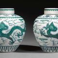 A fine pair of green-enamelled  'dragon' jars and covers. Qianlong seal marks and period