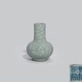 A small Guan-type bottle vase, Qianlong four-character seal mark in underglaze blue and of the period (1736-1795)