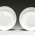A rare pair of slip-decorated white-glazed dishes, Qing dynasty, 18th century