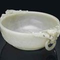 A large and finely carved pale celadon jade marriage bowl. Qianlong period  (1736-1795). 