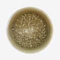 A small Chinese moulded 'Yaozhou' celadon glazed 'floral' bowl, Northern Song dynasty (960–1127) 