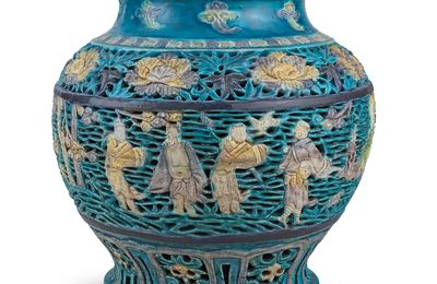 A reticulated fahua 'Immortals' baluster vase, 15th-16th century