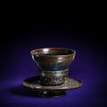 An heirloom 'haikatsugi tenmoku' tea bowl, Southern Song-Yuan dynasty, and a mother-of-pearl inlaid black lacquer bowl stand,  